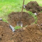 Preparing a hole for planting an apple tree